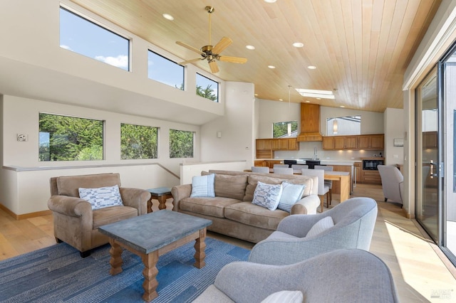 living area featuring light wood-type flooring, recessed lighting, and wooden ceiling