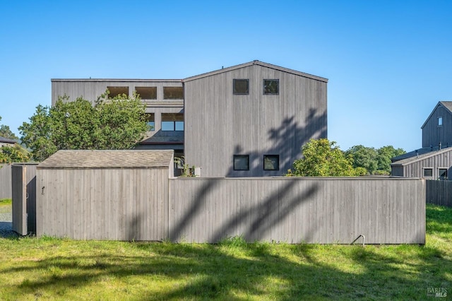 view of side of home featuring a lawn