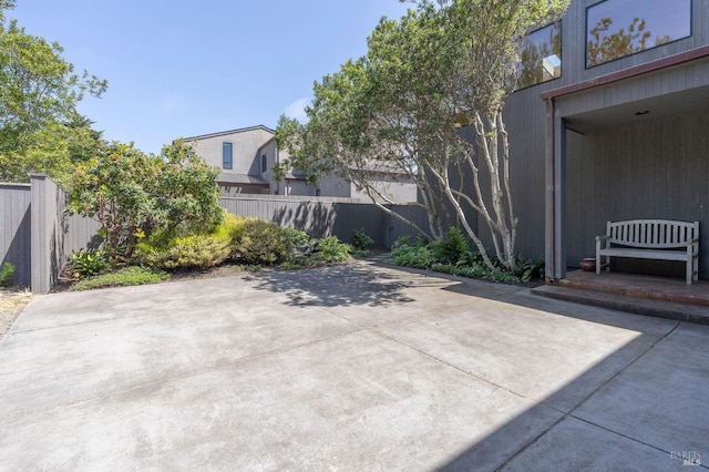 view of patio featuring fence