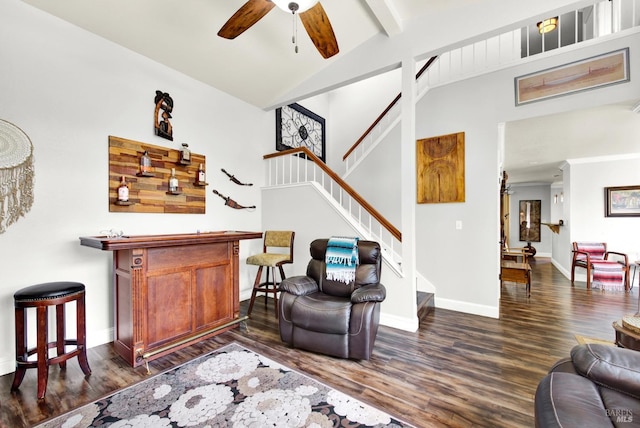 living room featuring dark wood-type flooring, baseboards, lofted ceiling with beams, and ceiling fan