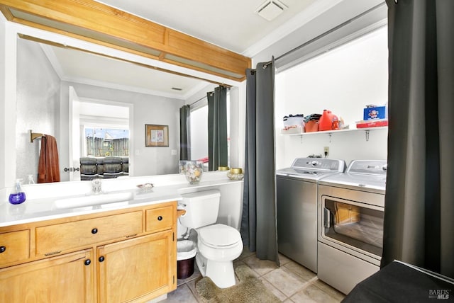 bathroom featuring toilet, tile patterned floors, visible vents, independent washer and dryer, and ornamental molding