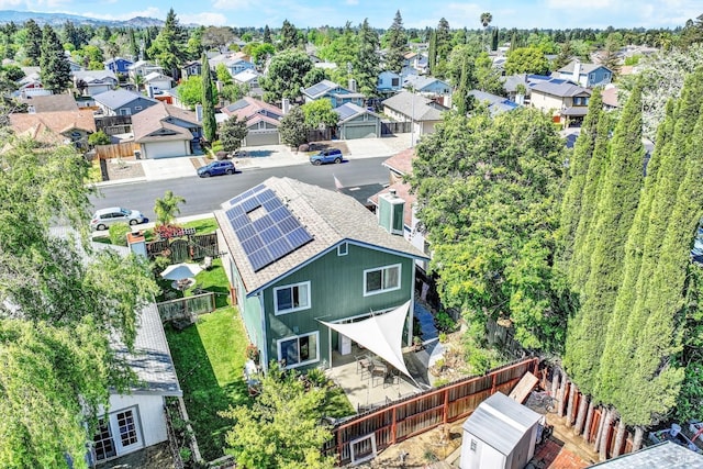 birds eye view of property with a residential view