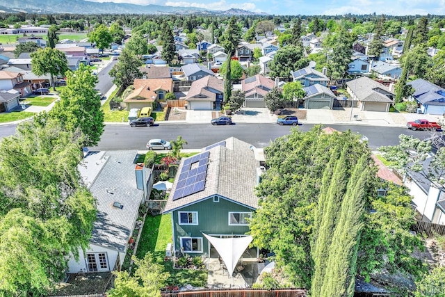 birds eye view of property featuring a mountain view and a residential view