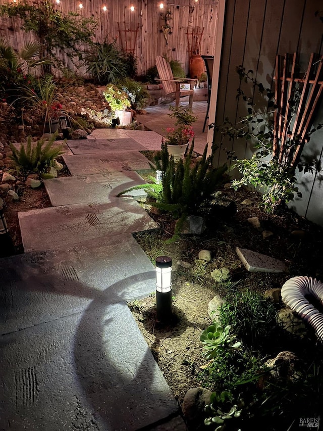 view of yard featuring a patio area and fence