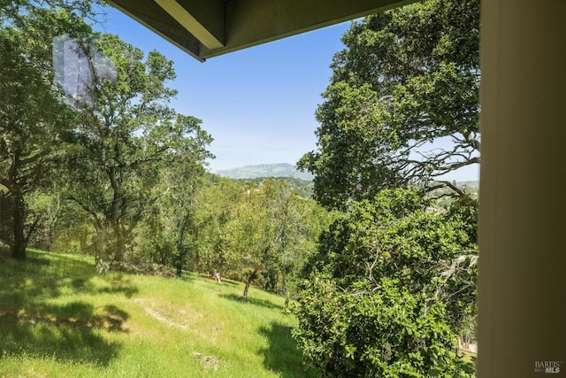 exterior space featuring a view of trees
