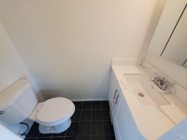 half bathroom featuring vanity, toilet, and tile patterned flooring