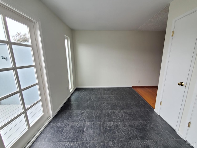 empty room with baseboards
