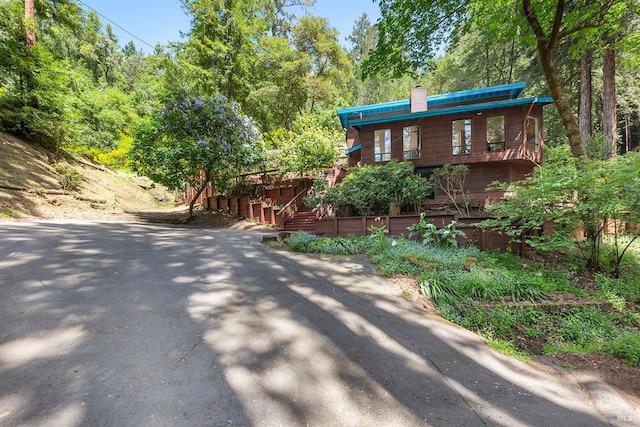 11969 Canyon Dr, Guerneville, CA 95446 - living room featuring a wood stove, vaulted ceiling, healthy amount of natural light, ceiling fan, and recessed lighting