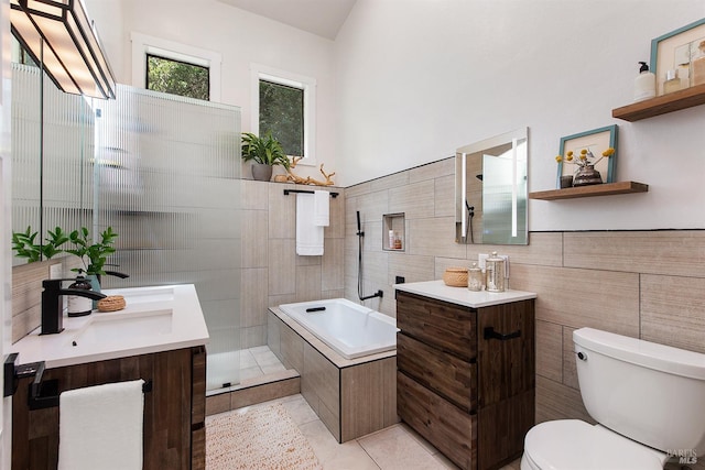 11969 Canyon Dr, Guerneville, CA 95446 - bathroom featuring tile walls, toilet, tile patterned floors, two vanities, and a tile shower
