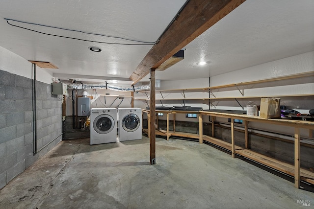 11969 Canyon Dr, Guerneville, CA 95446 - unfinished below grade area with washing machine and dryer, concrete block wall, and tankless water heater