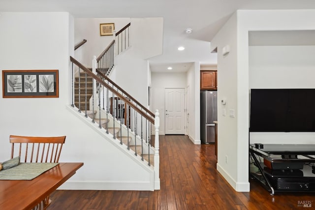 stairs with wood-type flooring, recessed lighting, and baseboards