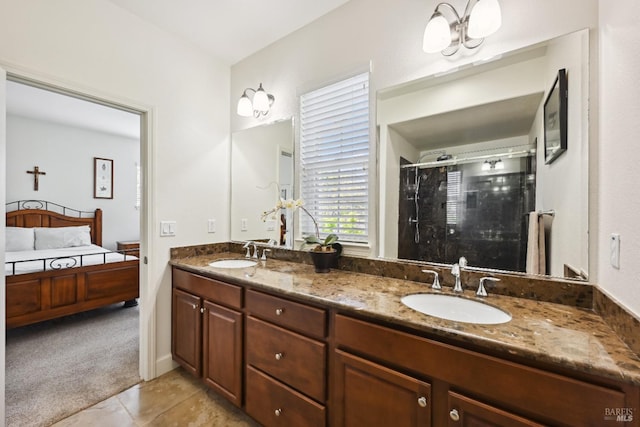 full bath featuring double vanity, a shower stall, tile patterned flooring, and a sink