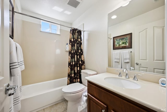 full bathroom with shower / bath combo, visible vents, toilet, vanity, and tile patterned flooring