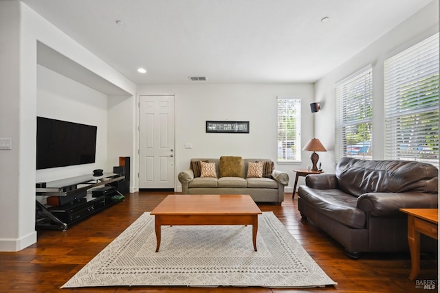 living area featuring dark wood finished floors, recessed lighting, and visible vents
