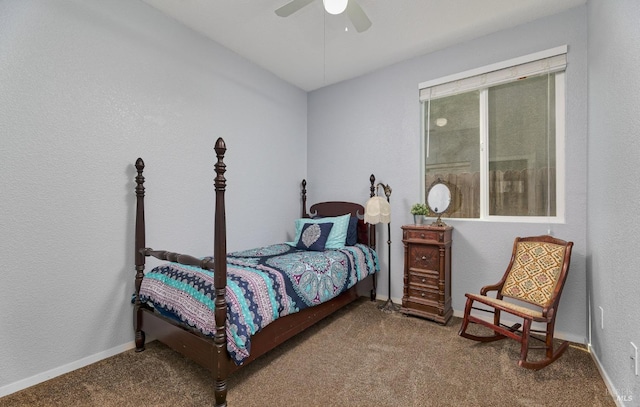 carpeted bedroom with a ceiling fan and baseboards
