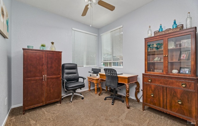 office space featuring ceiling fan, carpet, and baseboards