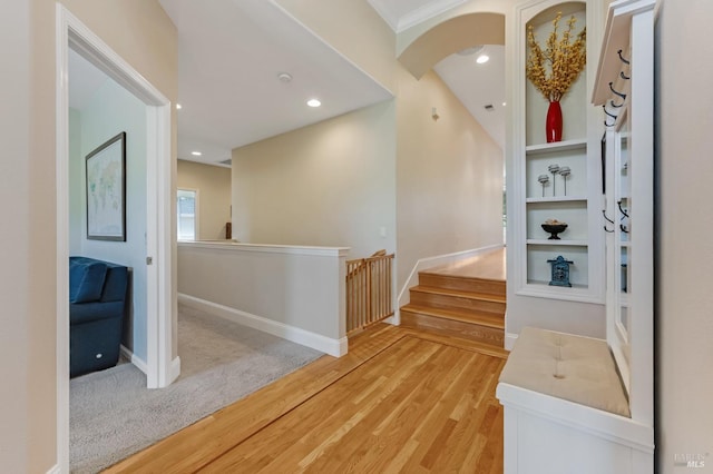 interior space featuring recessed lighting, baseboards, and light wood finished floors