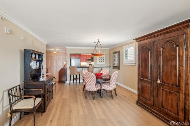 1483 Sutter St Unit 901, San Francisco, CA 94109 - dining space with light wood-type flooring, baseboards, and ornamental molding
