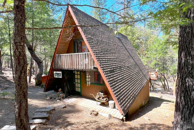 exterior space with a shingled roof