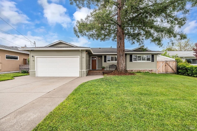 single story home with an attached garage, driveway, and a front yard