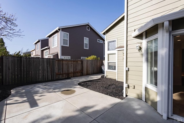 view of patio / terrace featuring fence