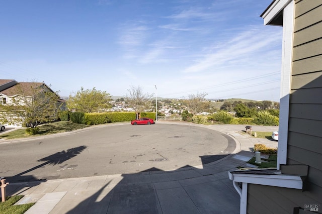 view of street featuring curbs