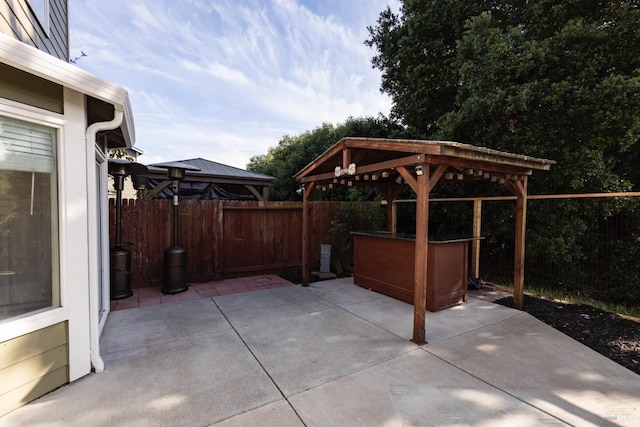 view of patio with a gazebo and a fenced backyard