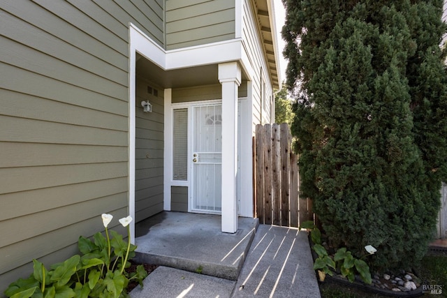 property entrance featuring fence