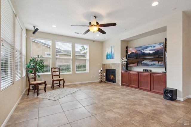 living room with recessed lighting, light tile patterned floors, ceiling fan, a fireplace, and visible vents