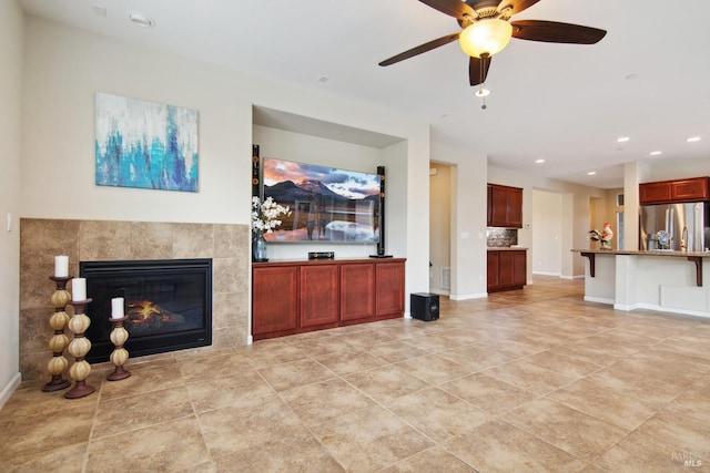unfurnished living room featuring recessed lighting, a tile fireplace, ceiling fan, baseboards, and light tile patterned flooring