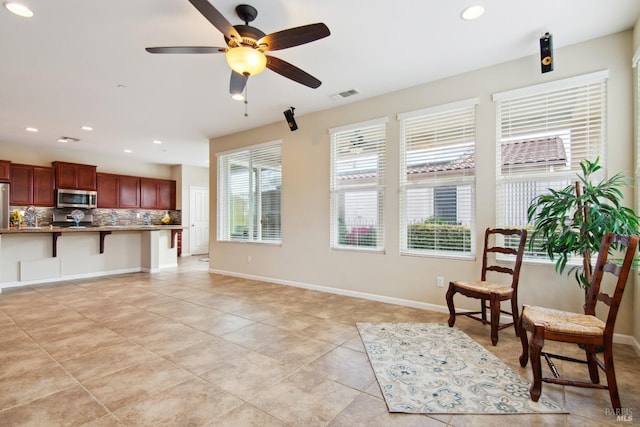 living area with recessed lighting, ceiling fan, baseboards, visible vents, and light tile patterned flooring