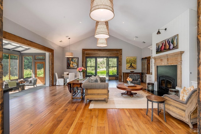 5310 Silverado Trl, Napa, CA 94558 - living room featuring a glass covered fireplace, high vaulted ceiling, and wood-type flooring