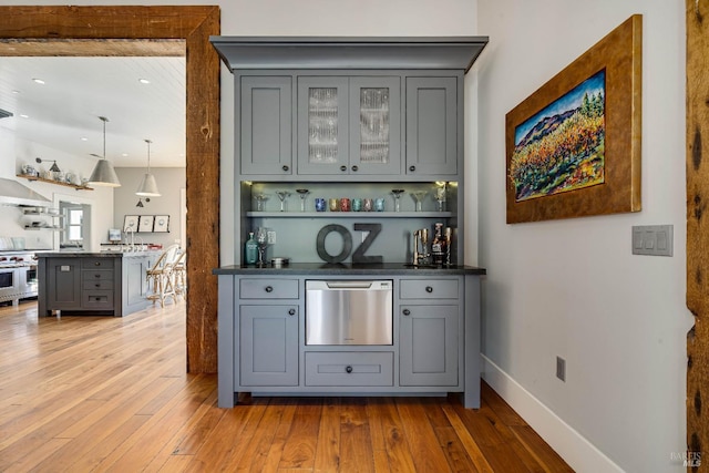 5310 Silverado Trl, Napa, CA 94558 - bar featuring baseboards, indoor bar, hardwood / wood-style floors, and stainless steel appliances