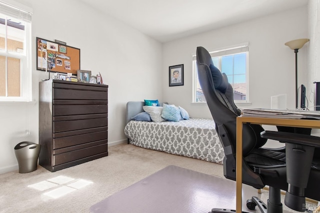 bedroom featuring baseboards and carpet floors