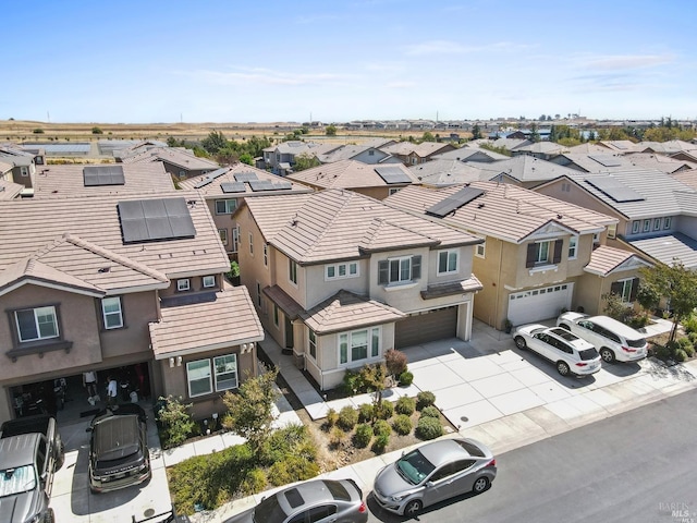 birds eye view of property with a residential view