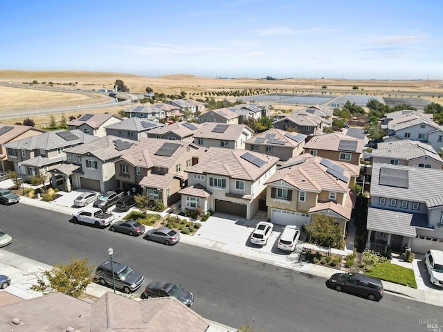 birds eye view of property with a residential view