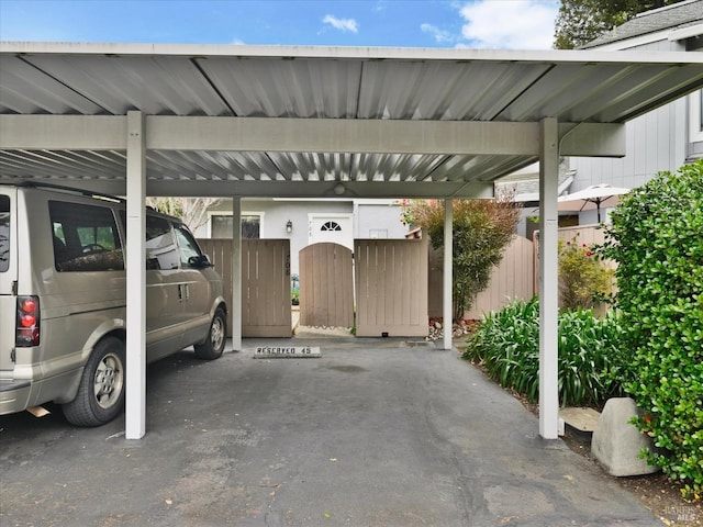 covered parking lot with fence