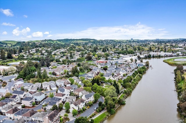 birds eye view of property with a water view and a residential view