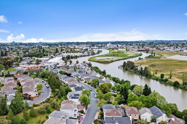 drone / aerial view with a water view and a residential view