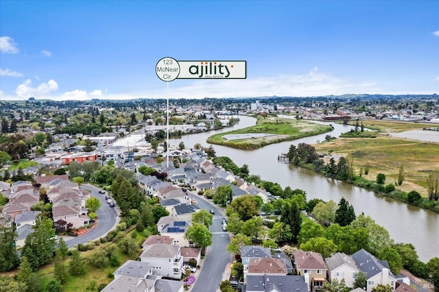drone / aerial view with a residential view and a water view