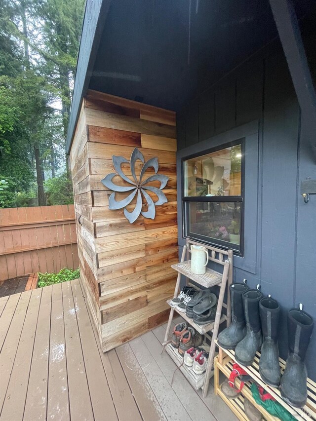 wooden deck featuring a yard