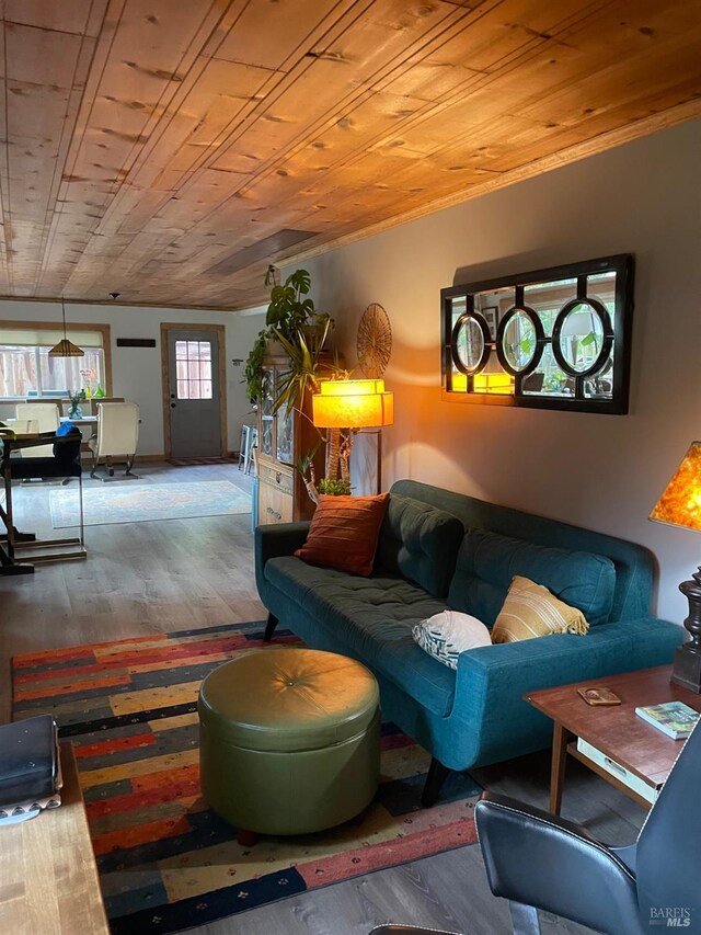 living room featuring wood ceiling and wood finished floors