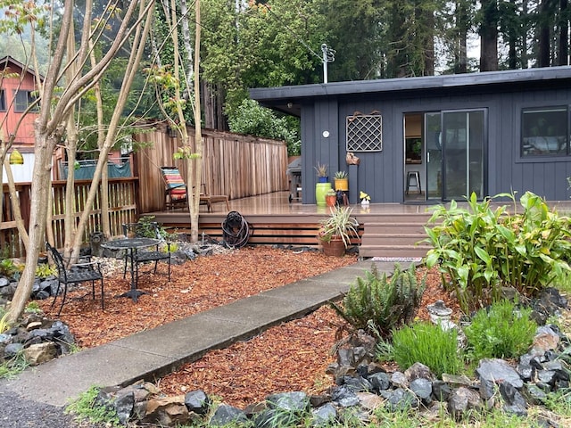 view of yard with fence and a deck