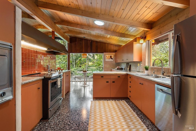 kitchen with wooden ceiling, lofted ceiling with beams, stainless steel appliances, light countertops, and a sink