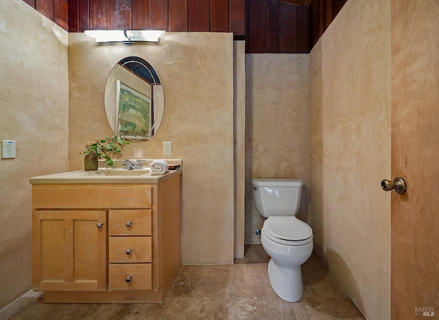 bathroom featuring toilet and vanity