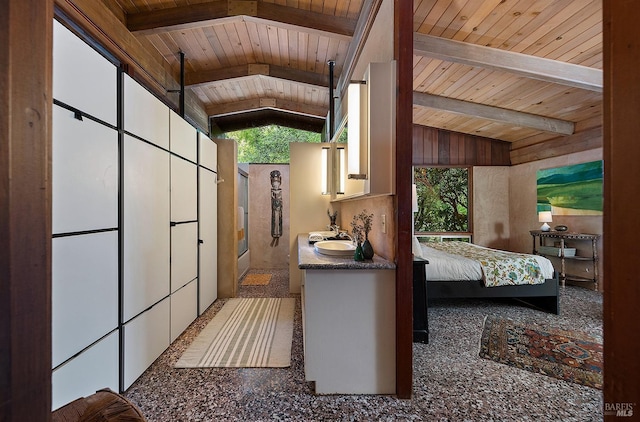 interior space with vaulted ceiling with beams and wooden ceiling