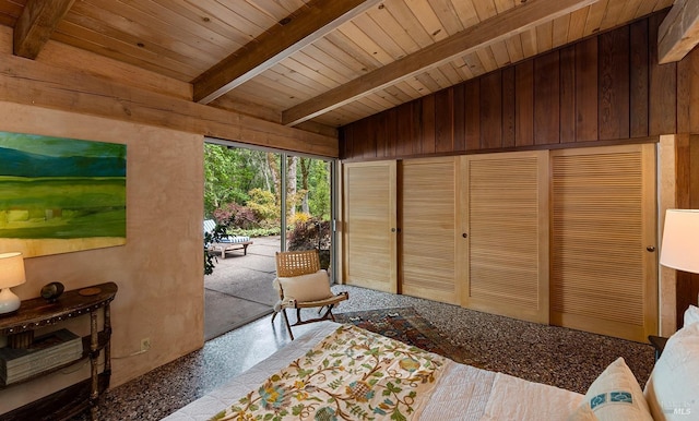 interior space featuring wood walls, wooden ceiling, and vaulted ceiling with beams