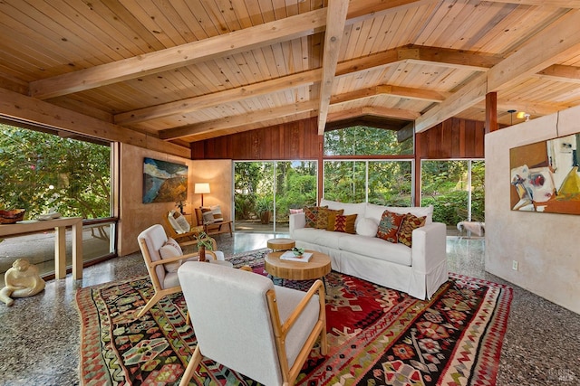 living room with wooden ceiling and vaulted ceiling with beams