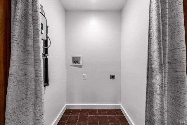 washroom featuring washer hookup, laundry area, electric dryer hookup, baseboards, and dark tile patterned floors