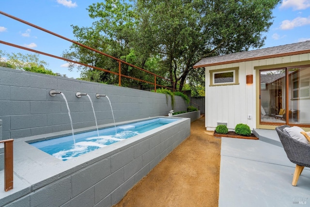 view of pool featuring fence, a hot tub, and a patio area
